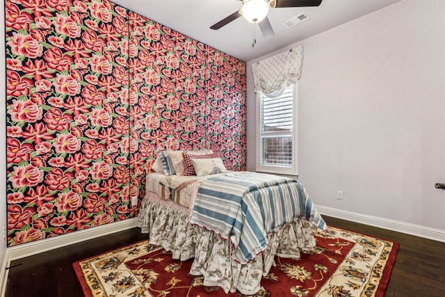 bedroom featuring dark hardwood / wood-style flooring and ceiling fan