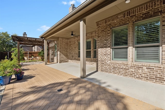 view of patio / terrace featuring ceiling fan and a pergola