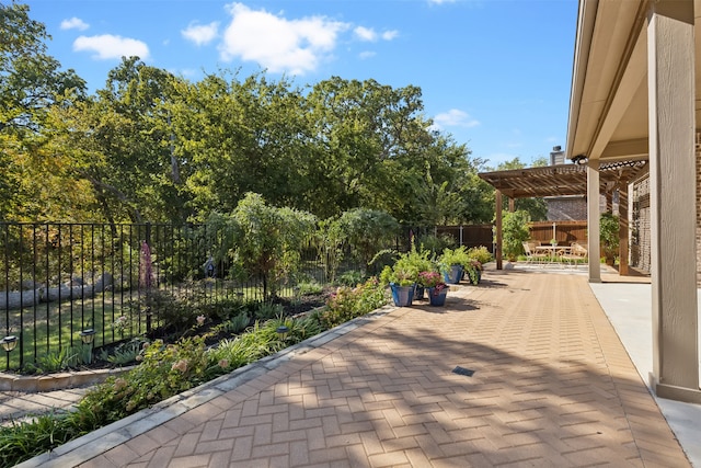 view of property's community featuring a patio and a pergola