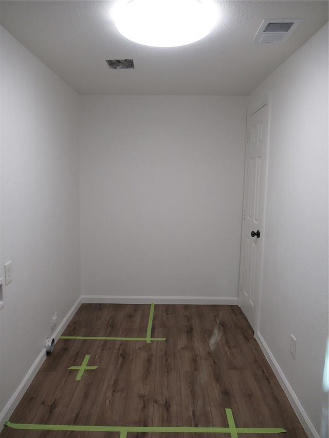 unfurnished room featuring dark hardwood / wood-style floors