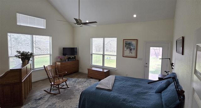 bedroom with ceiling fan, high vaulted ceiling, wood finished floors, baseboards, and access to exterior