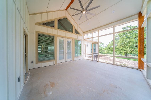 unfurnished sunroom featuring a wealth of natural light, lofted ceiling, french doors, and ceiling fan