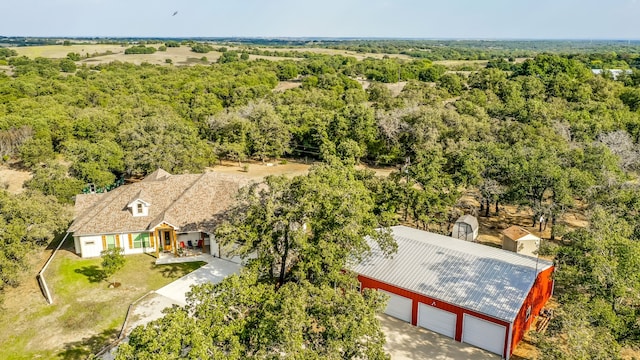 bird's eye view featuring a forest view