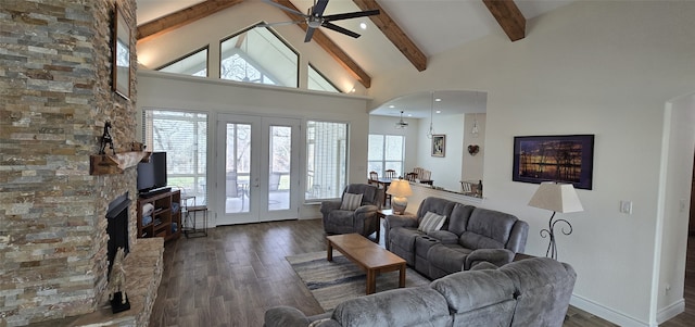 living area featuring high vaulted ceiling, french doors, dark wood finished floors, and beam ceiling