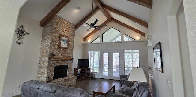 living room featuring french doors, dark wood-style flooring, a fireplace, high vaulted ceiling, and beamed ceiling