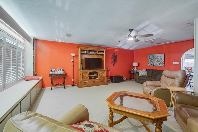 living room with ceiling fan and light carpet