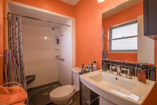 bathroom with a shower with curtain, sink, and toilet