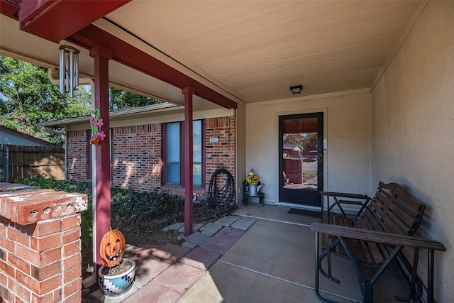 entrance to property featuring a patio