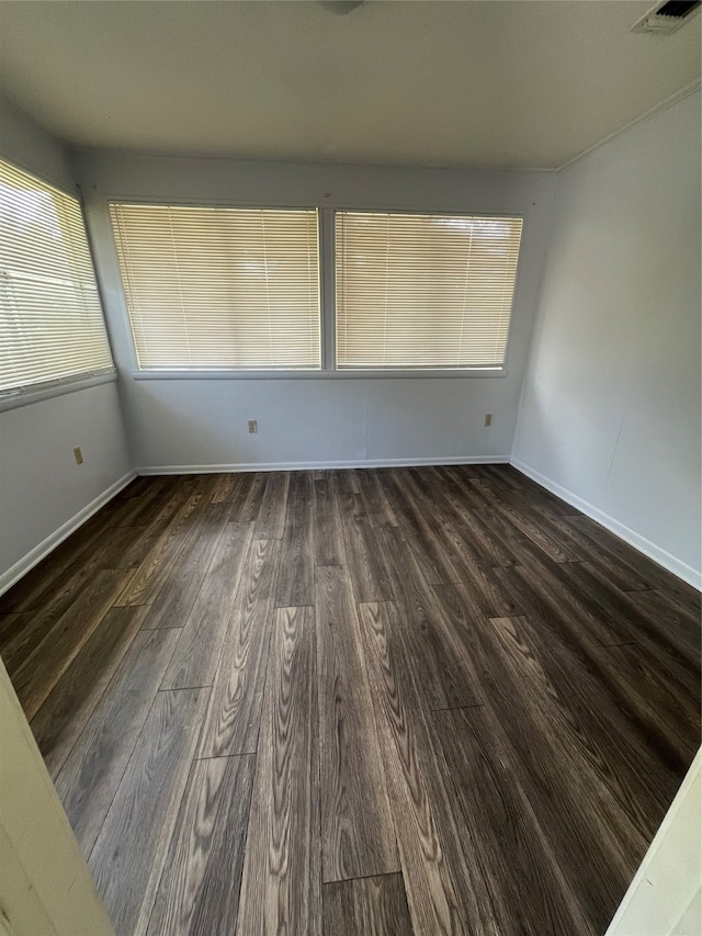 unfurnished room featuring dark hardwood / wood-style floors