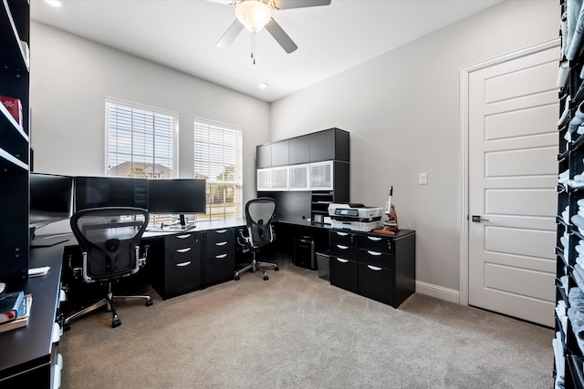 office space featuring light colored carpet and ceiling fan