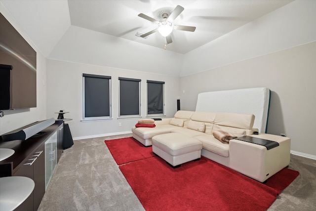 living room with vaulted ceiling, carpet floors, and ceiling fan