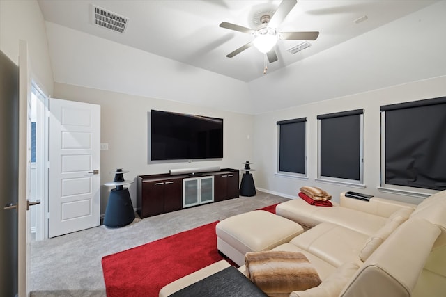 carpeted living room featuring vaulted ceiling and ceiling fan