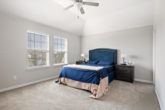 bedroom featuring vaulted ceiling, light carpet, and ceiling fan