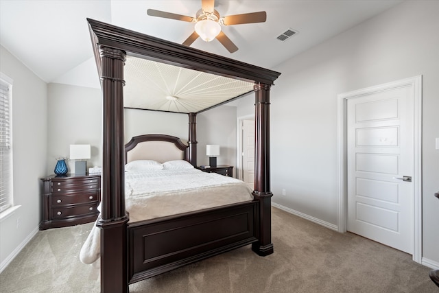 bedroom with lofted ceiling, light carpet, and ceiling fan