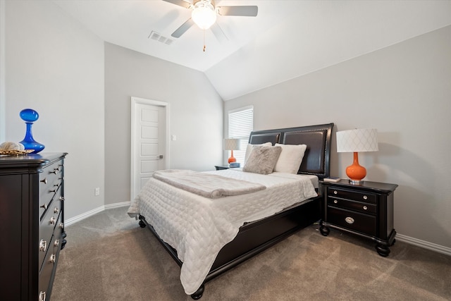 bedroom featuring vaulted ceiling, dark colored carpet, and ceiling fan