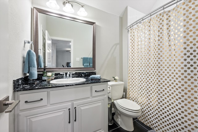 bathroom featuring vanity, a shower with curtain, toilet, and tile patterned floors