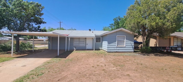 view of front of property featuring a carport