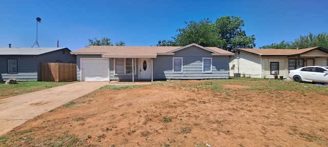 ranch-style house featuring a garage