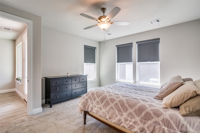 bedroom featuring ceiling fan and light hardwood / wood-style flooring