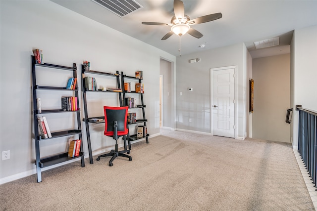 carpeted office featuring ceiling fan