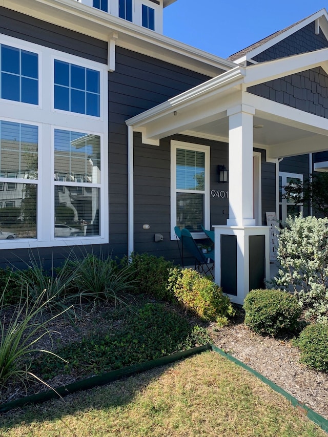 doorway to property with a porch