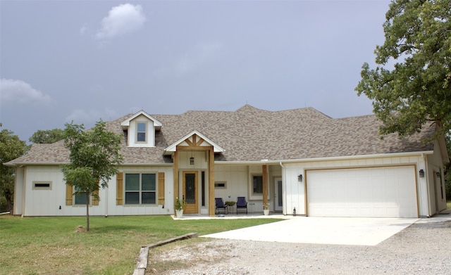 view of front of house with a front lawn and a garage