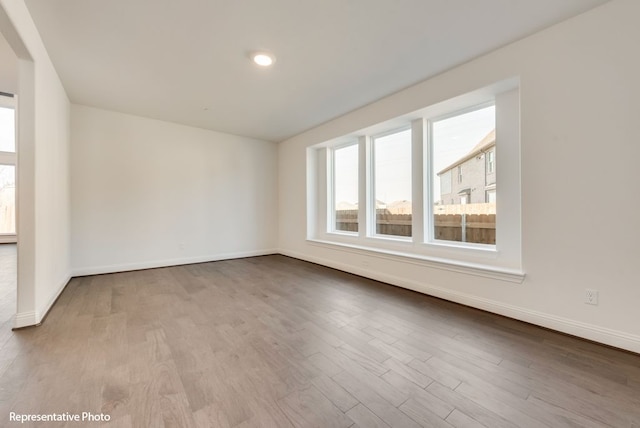 empty room with light wood-type flooring