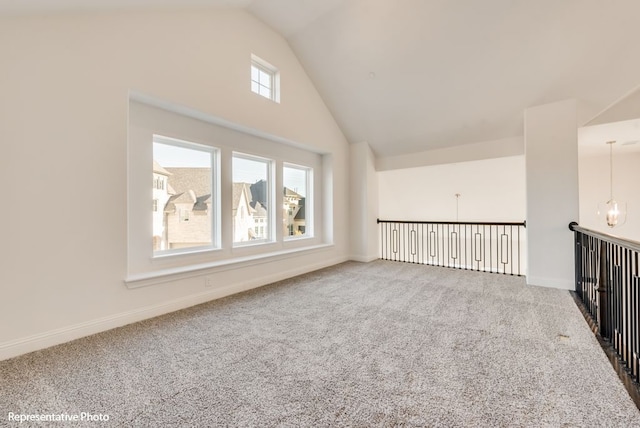 additional living space featuring carpet floors and high vaulted ceiling