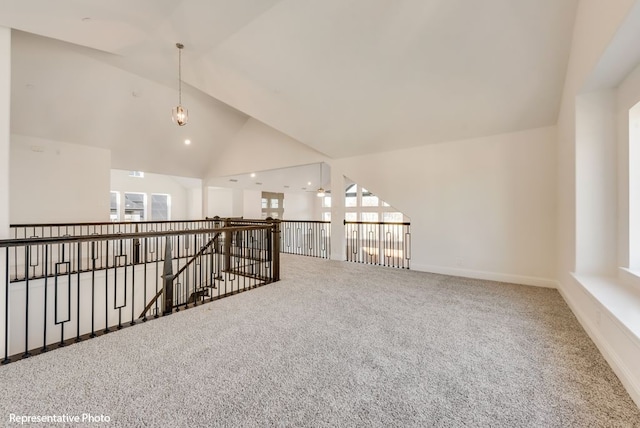 interior space featuring high vaulted ceiling and carpet