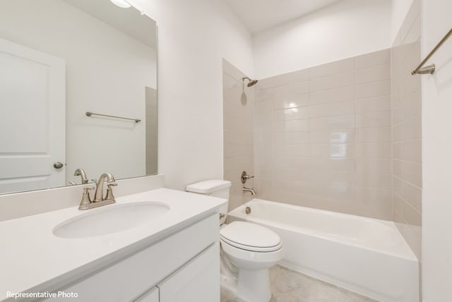 full bathroom with vanity, tiled shower / bath combo, and toilet