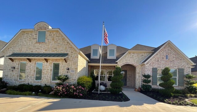 view of french country inspired facade