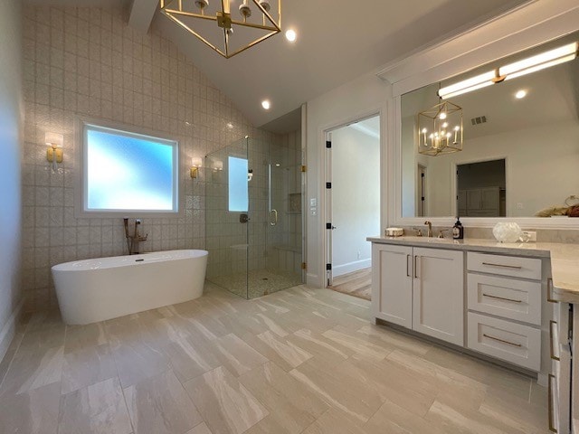 bathroom featuring tile walls, vanity, independent shower and bath, and vaulted ceiling with beams