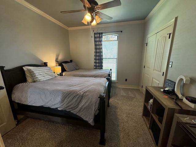 carpeted bedroom featuring a closet, ceiling fan, and crown molding