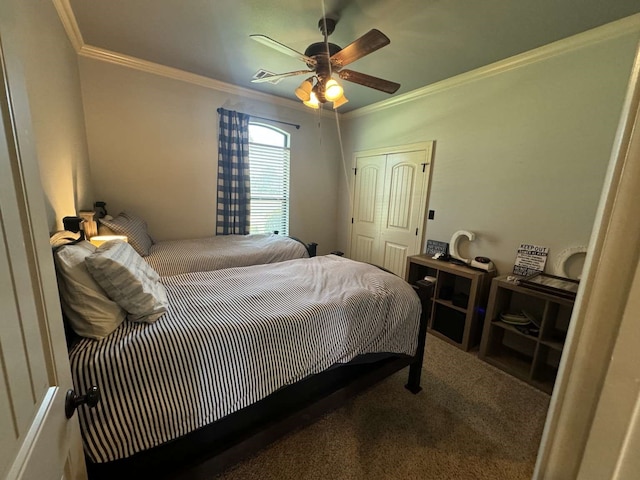 bedroom featuring a closet, ceiling fan, crown molding, and carpet floors