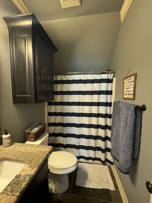 bathroom featuring toilet, ornamental molding, vanity, curtained shower, and tile patterned flooring