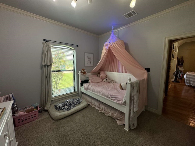 bedroom with crown molding and hardwood / wood-style flooring