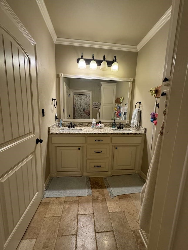 bathroom featuring vanity and ornamental molding