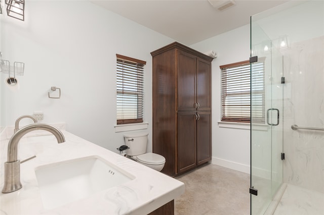 bathroom with concrete flooring, vanity, toilet, and walk in shower