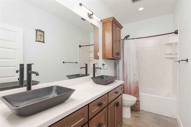 full bathroom with shower / bath combination with curtain, vanity, and toilet