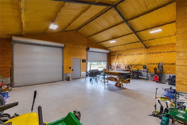 garage featuring wood walls and wood ceiling