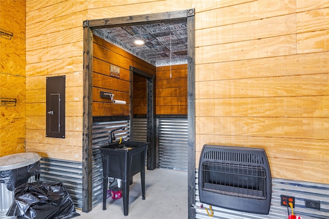 view of patio / terrace featuring electric panel and heating unit