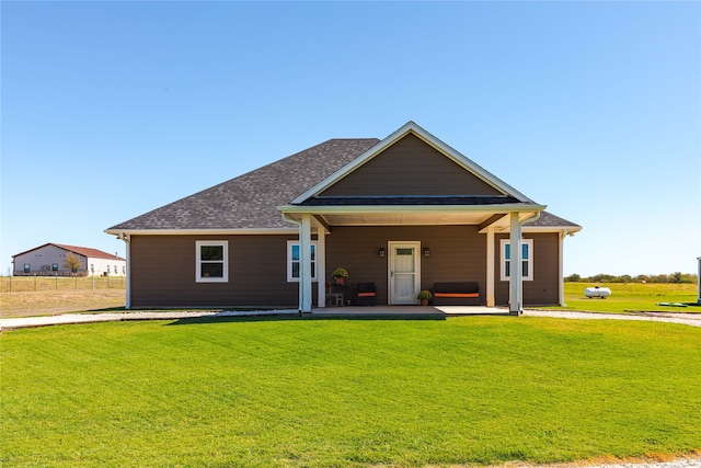 view of front of home featuring a porch and a front yard