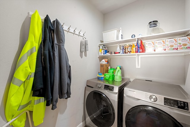 clothes washing area with washer and clothes dryer