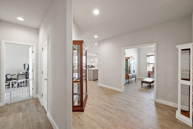 hallway with light wood-type flooring