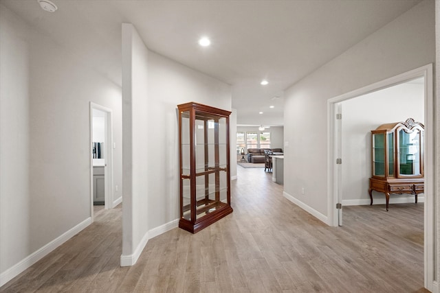 hall with light hardwood / wood-style floors