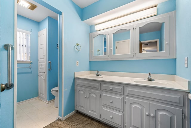 bathroom with toilet and vanity