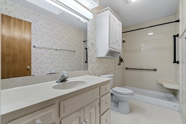 bathroom with vanity, a shower, toilet, and tile patterned floors