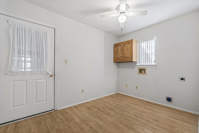 clothes washing area featuring hookup for a washing machine, hookup for an electric dryer, light wood-type flooring, cabinets, and ceiling fan