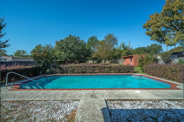 view of swimming pool featuring a patio