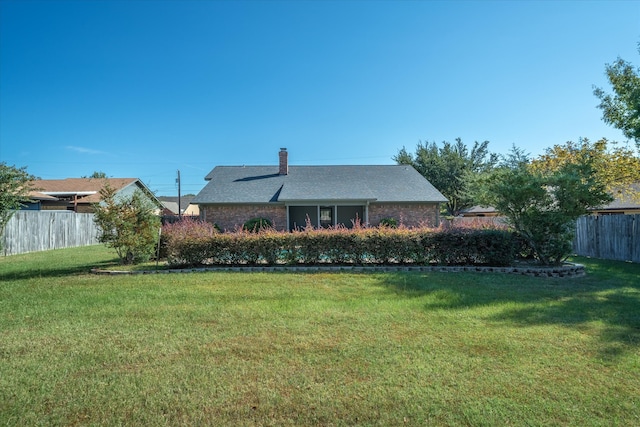 exterior space with a front yard